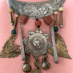 Aztec style pin with traditional symbols